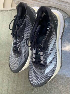 Adidas Black & White Boston 12. Slightly used. Too big for me
